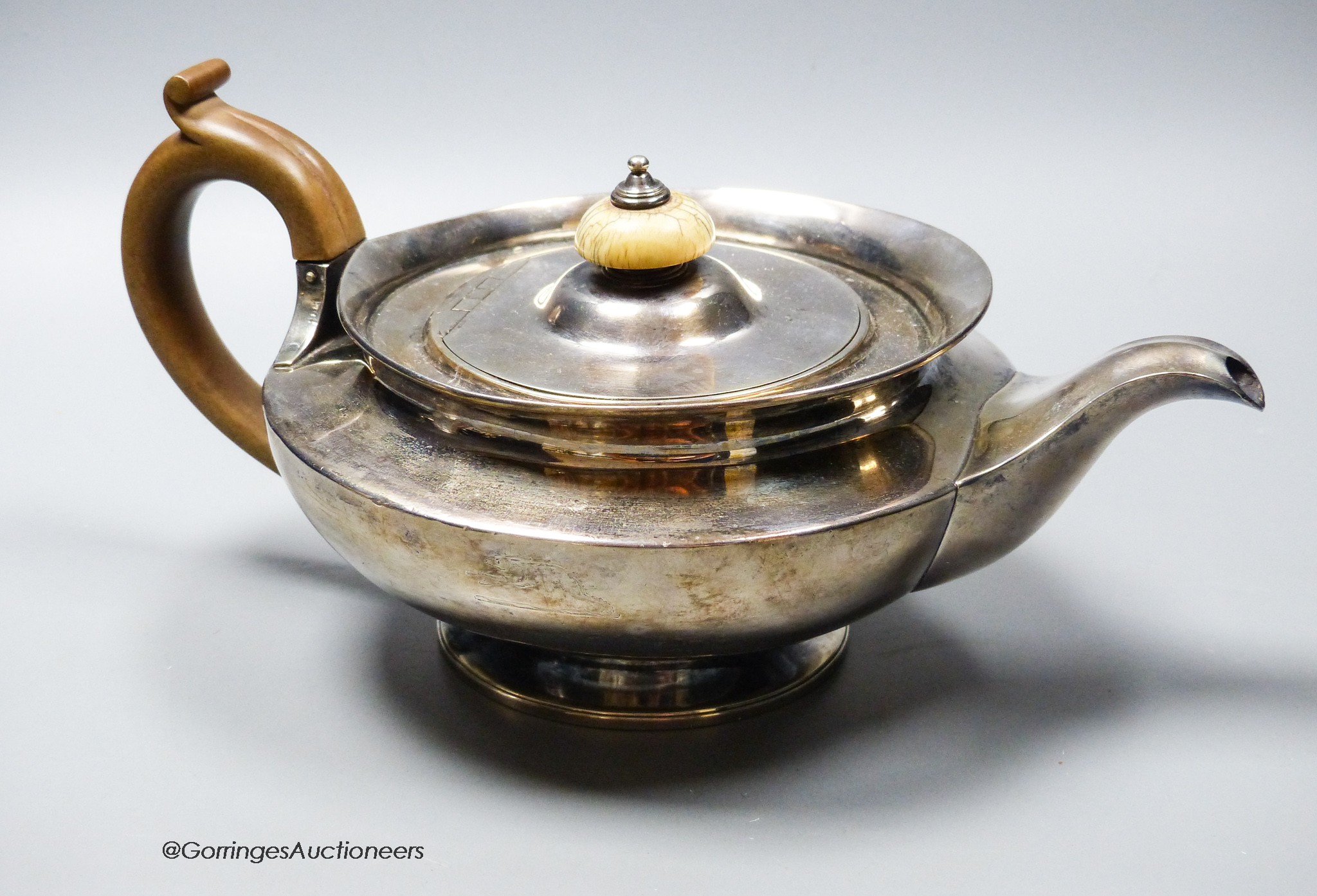 A George IV silver squat circular teapot by William Eley II, London, 1826, gross 23oz.